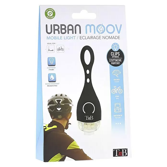 T'nB Linterna para bicicletas - Blanco - Embalaje de una luz móvil negra TnB Urban Moov, mostrada enganchada al casco. 3 ajustes y resistente al agua.