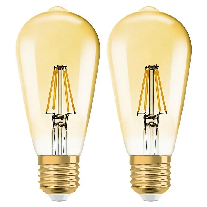 Osram LED-Lampen Set Vintage Edition 1906 Birnenform E27 2er Set - E27, Dimmbar, Warmweiß, 725 lm, 6,5 W - Zwei goldfarbene LED-Filamentlampen mit Edison-Sockel vor schwarzem Hintergrund.