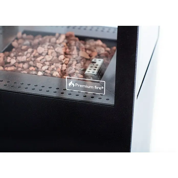Estufa de exterior París - Potencia calorífica: 6,5 kW, Altura: 132,5 cm - Primer plano de una mesa de fuego premium con rocas de lava y un moderno diseño negro.