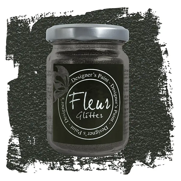 Fleur Purpurina Glitter - Black, 90 g, Brillante - Primer plano de un tarro de Fleur Designer's Paint Glitter en un color oscuro, con tapa plateada y fondo artístico.