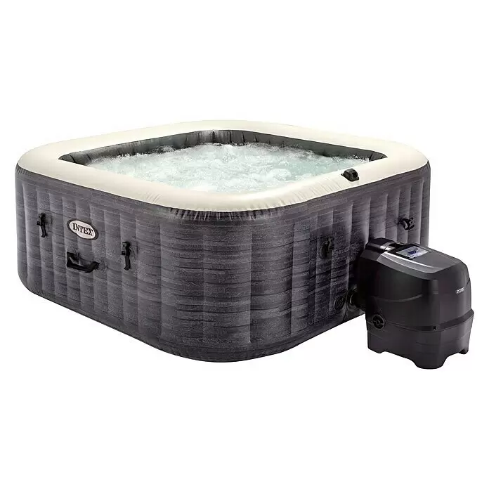 Intex Pure Spa Mobil-Whirlpool Greystone Deluxe - L x B x H: 196 x 196 x 71 cm, Grau, 1.098 l - Aufblasbarer grauer Whirlpool mit cremefarbenem Rand und sprudelndem Wasser, verbunden mit einer schwarzen Steuerung.