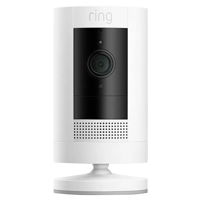 Ring Cámara de vigilancia Stick Up - Blanco, Ángulo de detección: 110 °, A batería - Cámara de seguridad Ring blanca y negra con lente central, rejilla de altavoz y soporte blanco a juego.