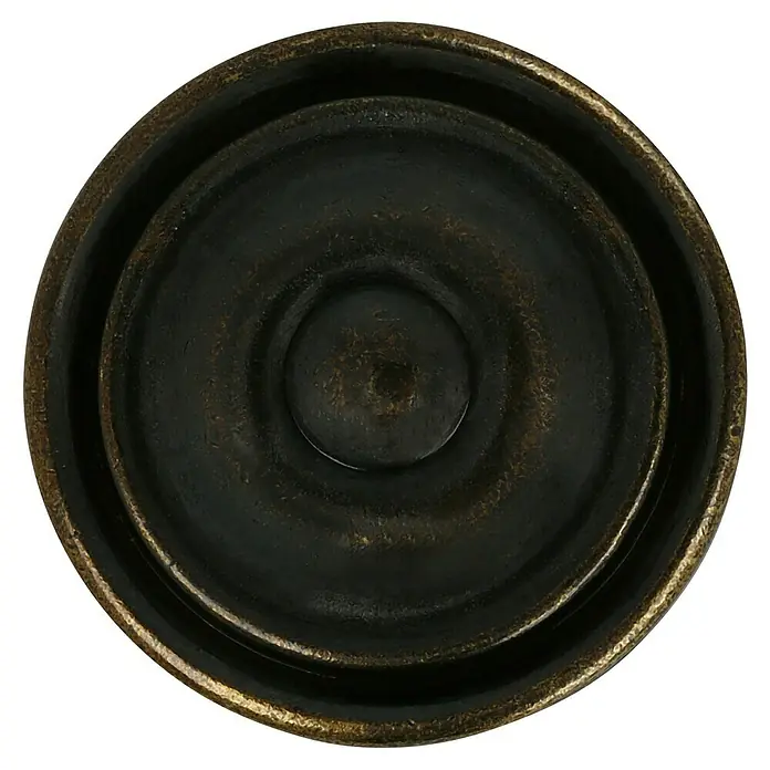 Häfele Pomo para muebles - Tipo de tirador del mueble: Botón, Ø x Al: 36 x 26 mm, Marrón - Primer plano de un tirador de mueble redondo color bronce con círculos concéntricos y un centro elevado sobre un fondo negro.