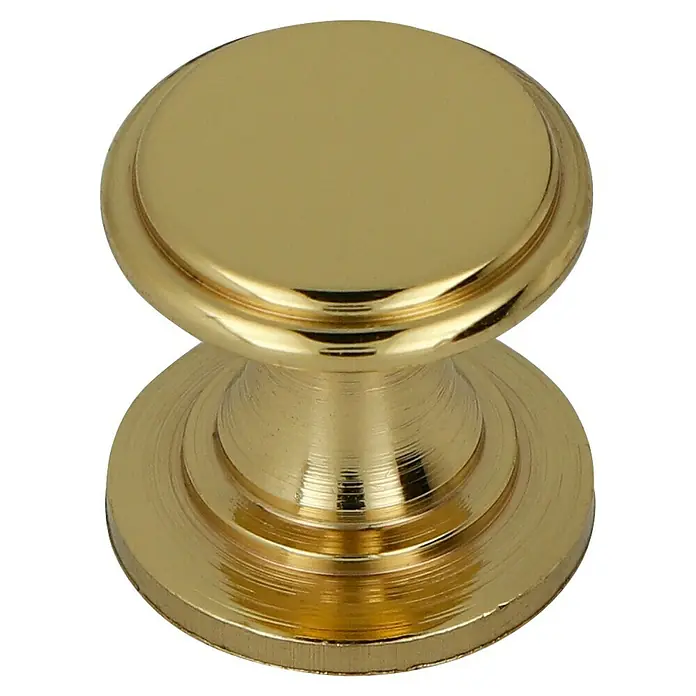 Häfele Pomo para muebles - Tipo de tirador del mueble: Botón, Ø x L: 12 x 11 mm - Primer plano de un tirador de cajón redondo y dorado, que muestra un detalle elegante y funcional de los muebles.