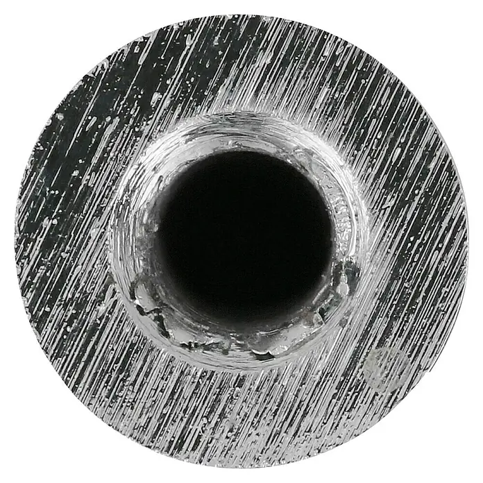 Häfele Pomo para muebles - Tipo de tirador del mueble: Botón, Ø x Al: 14 x 26 mm, Cromado, Mate - Primer plano de un producto metálico redondo de color plateado con un orificio central. La superficie muestra texturas de mecanizado.