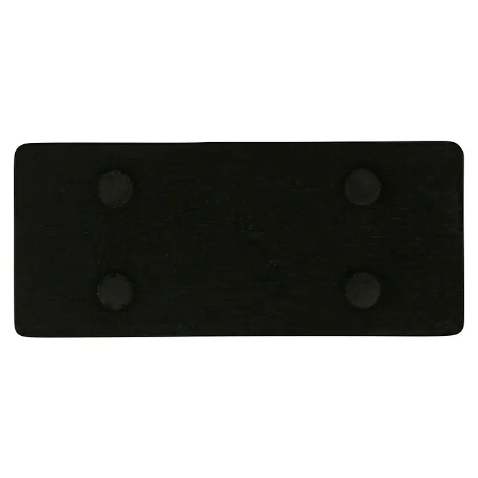 Häfele Tirador para muebles - Tipo de tirador del mueble: Estribo, L x An x Al: 58 x 26 x 25 mm - Primer plano de una tabla de madera negra con cuatro pies redondos para estabilidad y protección de la superficie.
