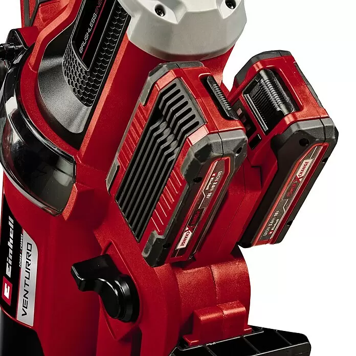 Einhell Professional PXC 18V Soplador/Aspirador de batería VENTURRO 36/240 - 18 V, Sin batería, Velocidad de soplado: 240 km/h - Primer plano de una herramienta eléctrica roja Einhell Venturro con dos baterías Power X-Change de 18V.