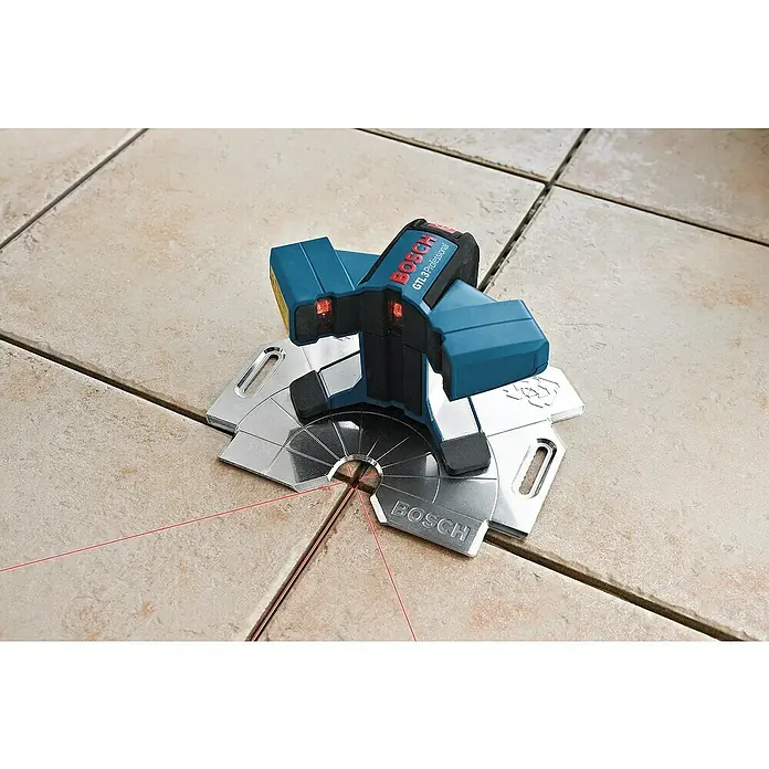 Bosch Professional Fliesenlaser GTL 3 - Max. Arbeitsbereich: 20 m, 4 -tlg. - Bosch GTL 3 Professional Fliesenlaser auf beigen Fliesen, der rote Laserlinien projiziert, für präzises Verlegen.