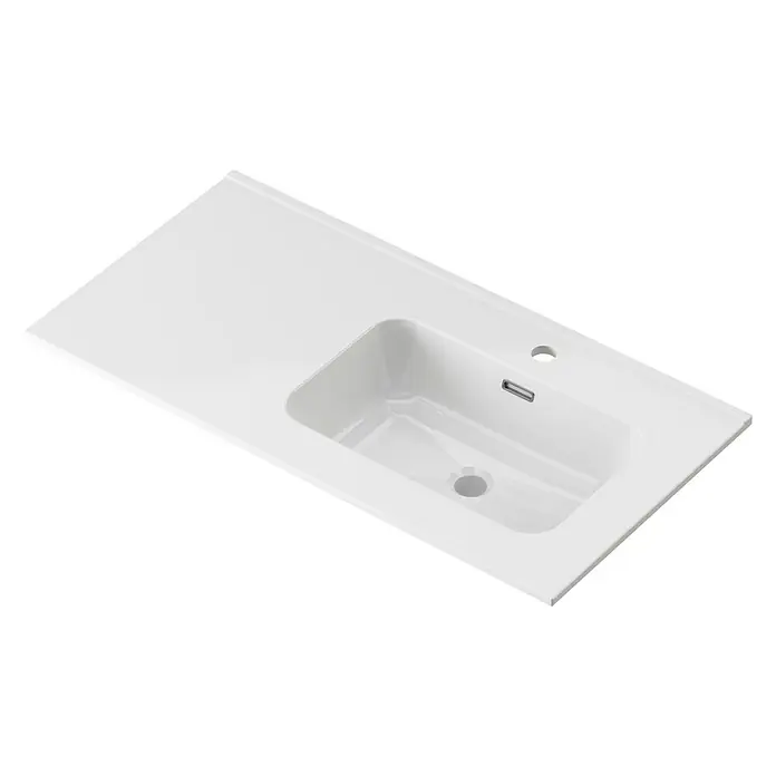 Lavabo Spectra seno derecha - 46 x 91 cm, Orificios para grifo: Medio, Con desbordamiento, Blanco - Esta imagen muestra un lavabo de cerámica con rebosadero y orificio para grifo. El lavabo es rectangular y tiene una superficie blanca y lisa.