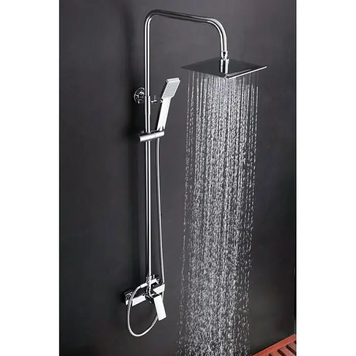 Imex Bali Sistema de ducha - Con grifo monomando, Número de tipos de chorro: 1 ud., Cromo - Imagen de un moderno conjunto de ducha con rociador y teleducha en cromo, montado contra una pared oscura. El agua fluye del rociador.