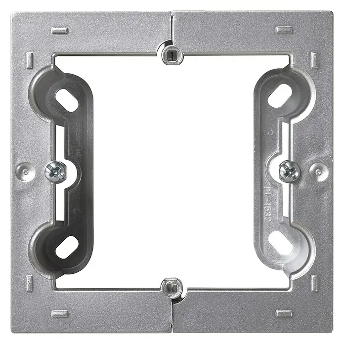 Simon 10 Caja de superficie - 4 x 8,4 x 8,4 cm, Colocar, Aluminio - Primer plano de una placa de montaje cuadrada plateada con una abertura cuadrada en el centro. Ideal para instalaciones eléctricas.