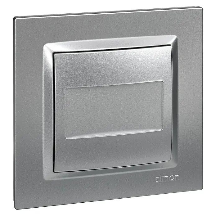 Simon 10 Tapa ciega - Aluminio, Plástico, IP20, Instalar - Primer plano de una cubierta de interruptor de luz plateada Simon, que muestra su diseño moderno y acabado de alta calidad.