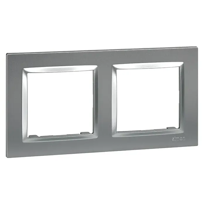 Simon 10 Marco - Aluminio, Modelo de mecanismos: x 2, Plástico, Colocar - Primer plano de una cubierta de marco doble plateada de Simon, que ofrece un diseño elegante y moderno para interruptores y enchufes.