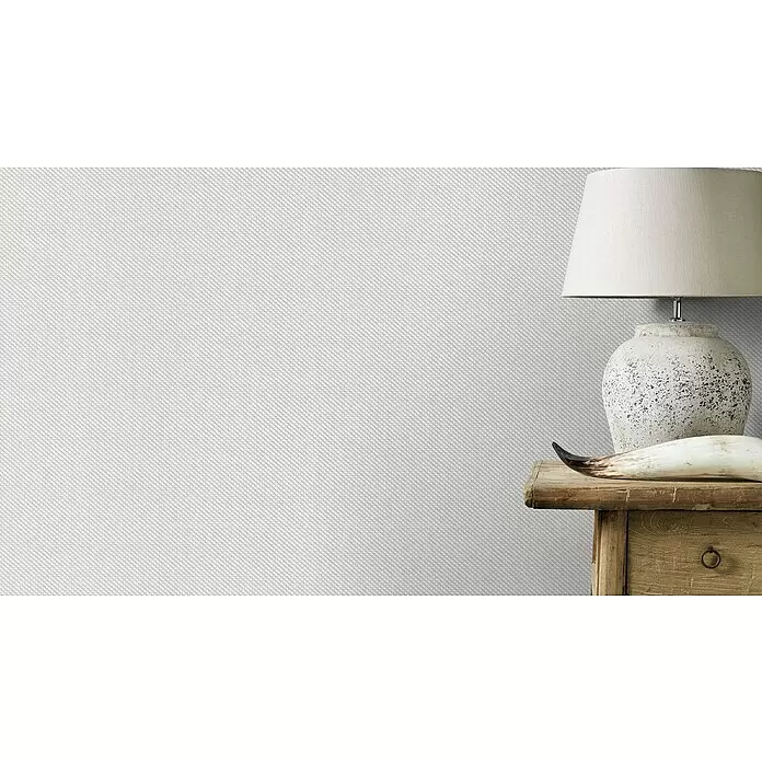 Rasch Wallton Vliestapete Glasfaser-Optik - Weiß, Uni, 10,05 x 0,53 m, Wabenstruktur, Matt - Weiße Wandverkleidung mit feiner, geometrischer Textur, eingesetzt in einem Innenraum.