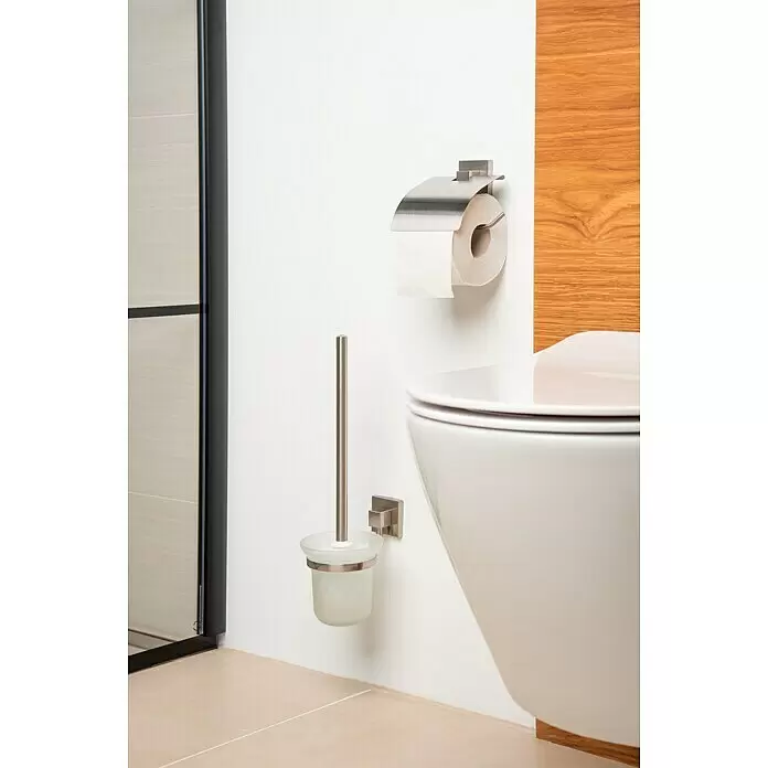 Venus Nemo Toilettenpapierhalter - Mit Deckel, Edelstahl, Gebürstet - Toilettenpapierhalter aus gebürstetem Edelstahl und Klobürstenhalter aus Milchglas neben Toilette.