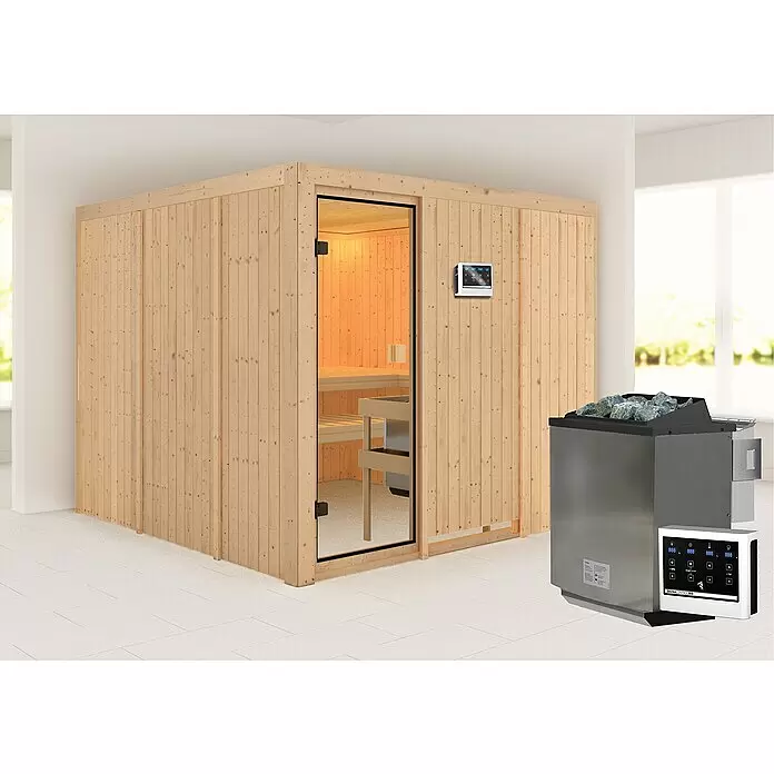 Karibu Elementsauna Arvika - Mit 9 kW Bio-Ofen mit externer Steuerung, L x B x H: 231 x 231 x 198 cm - Eine helle Holzsaunakabine mit Glastür, internem Bedienfeld und separatem silbernen Saunaofen mit externem Bedienfeld in einem hellen Raum.