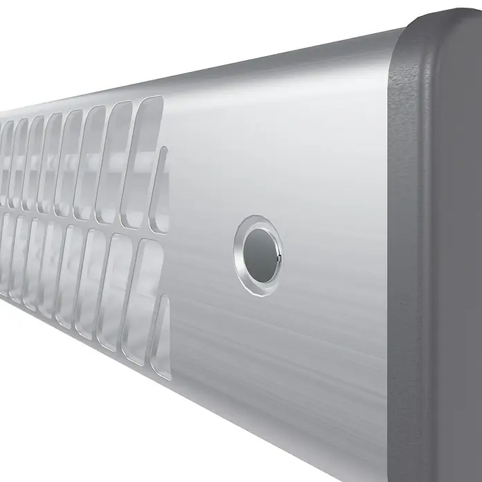 Voltomat HEATING Quarzheizstrahler - 14 x 60 x 13 cm, 1.200 W, Chrom - Nahaufnahme eines eleganten, länglichen Geräts mit einem Gitterdesign und einem runden Ausschnitt, das moderne Technologie und Stil vereint.