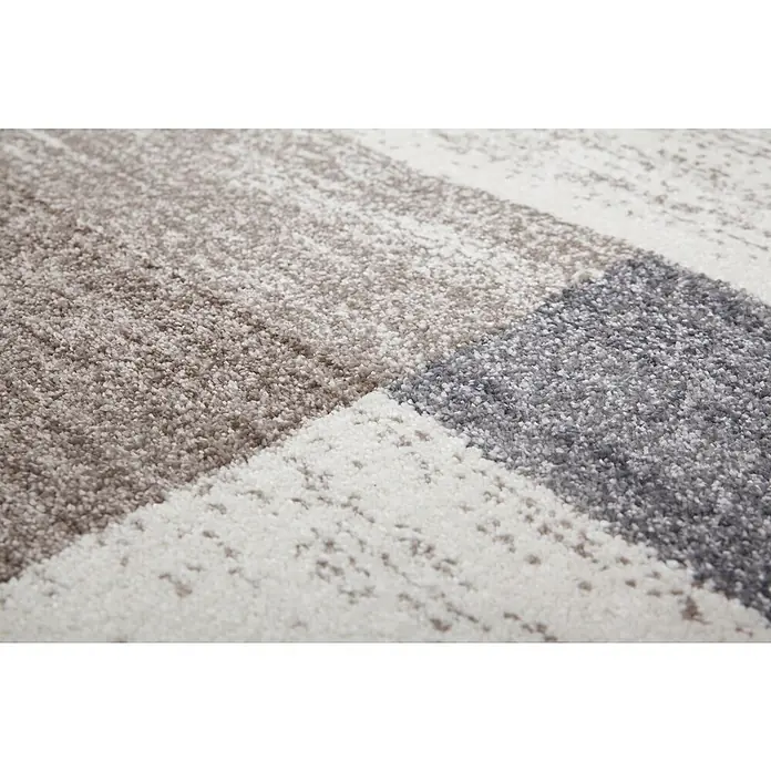 Kurzflorteppich Feeling 501 - Beige/Silber, 230 x 160 cm, 100 % Polypropylen (Flor) - Nahaufnahme eines modernen Teppichs mit geometrischen Mustern in Grau-, Beige- und Weißtönen. Die Textur des Teppichs ist deutlich erkennbar.