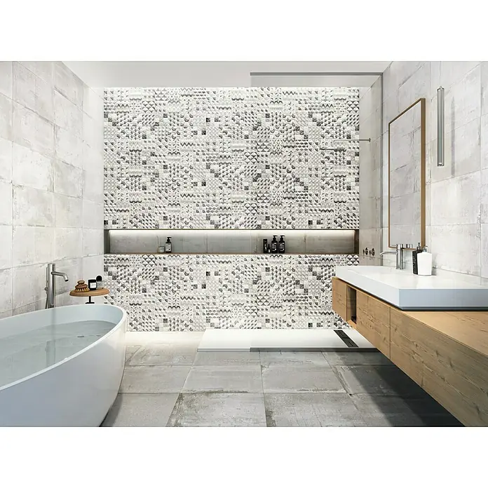 Feinsteinzeugfliese Bond Ash - 60 x 60 cm, Grau, Matt - Badezimmer mit weißer Badewanne und modernem Waschtisch mit geometrisch gemusterter Fliesenwand für ein stilvolles Design.