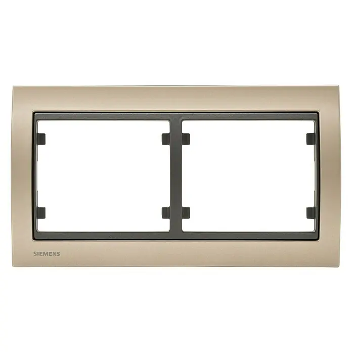 Siemens Delta Iris Marco - Dorado Malta, Modelo de mecanismos: x 2, Aluminio, Colocar - Primer plano de una placa de interruptor doble Siemens dorada, perfecta para interiores modernos. Ofrece una solución elegante para interruptores de luz.