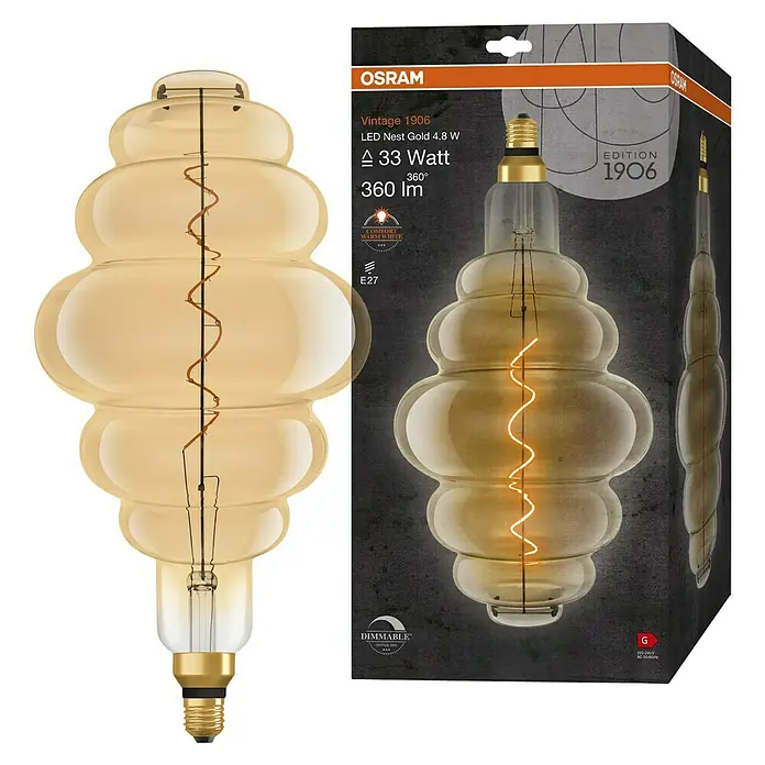 Osram LED-Lampe Vintage Edition 1906 Glühlampenform E27 - E27, Dimmbar, Warmweiß, 360 lm, 4,8 W - Nahaufnahme der Osram Vintage 1906 LED Nest Gold 4,8 W Lampe und ihrer Verpackung. Dekorative, dimmbare Glühbirne mit warmweißem Licht.