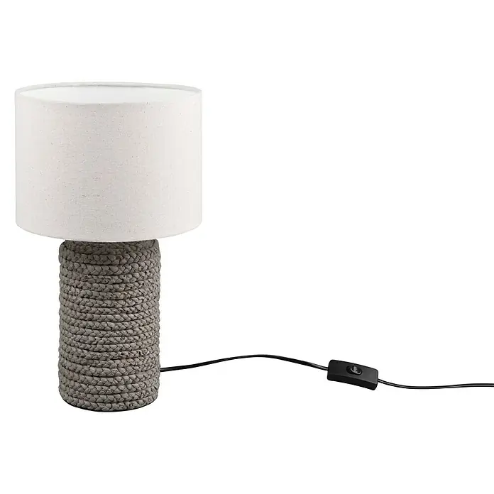 Trio Lighting Lámpara de sobremesa redonda Mala - 60 W, Ø x Al: 22 cm x 38 mm, Natural, E27 - Primer plano de una lámpara de mesa con base tejida y pantalla cilíndrica sobre fondo negro.