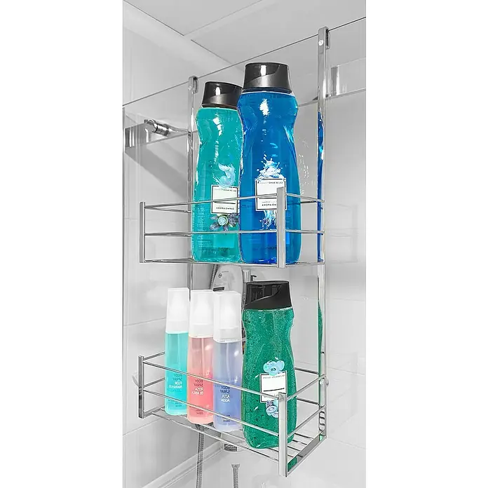 Cesta de baño mampara -  - Estante de ducha con varios geles de ducha y aerosoles de diferentes colores. El estante es cromado y cuelga de la pared de la ducha.