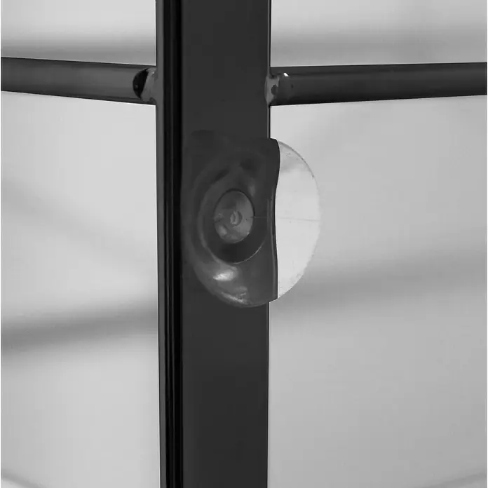 Cesta de baño mampara -  - Primer plano de un mueble con elementos metálicos y una cubierta redonda transparente fijada a un marco.
