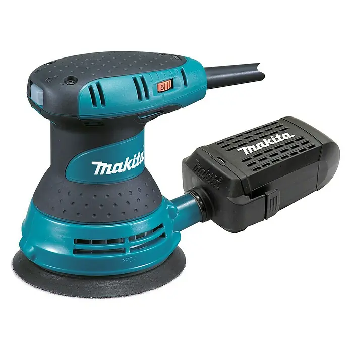 Makita Lijadora excéntrica eléctrica BO5031J - 300 W, Diámetro disco de lija: 125 mm - Primer plano de una lijadora orbital Makita, con recipiente de recogida de polvo.