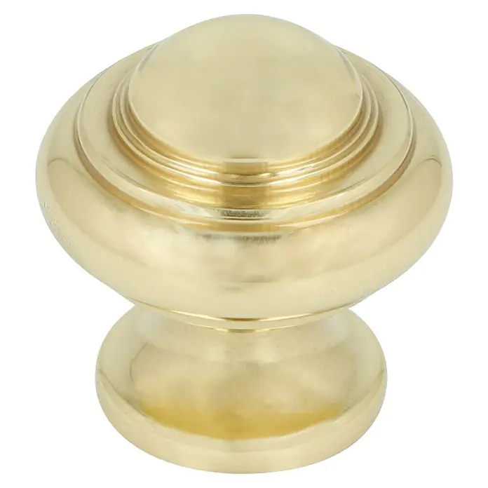 Häfele Pomo para muebles - Tipo de tirador del mueble: Botón, Ø x Al: 24 x 25 mm - Primer plano de un elegante pomo de mueble de color dorado con detalles delicadamente elaborados.