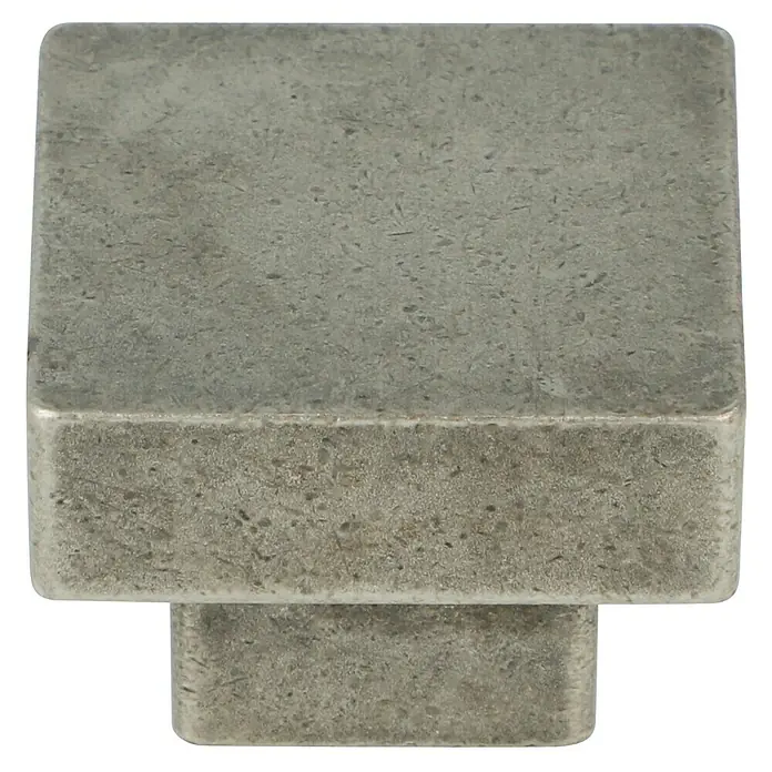 Häfele Pomo para muebles - Tipo de tirador del mueble: Botón, Niquelado, Gris - Primer plano de un tirador cuadrado de mueble gris con una superficie ligeramente texturizada, ideal para armarios modernos.