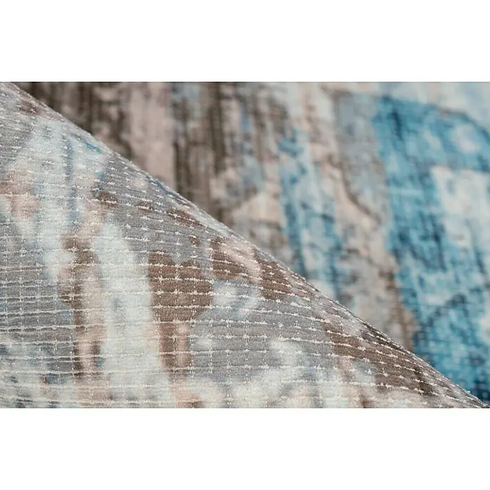 Kayoom Kurzflorteppich Indiana - Blau/Braun, 150 x 80 cm, 100 % Baumwolle - Nahaufnahme eines abstrakt gemusterten Teppichs in Blau-, Grau- und Brauntönen, der eine moderne und künstlerische Note verleiht.