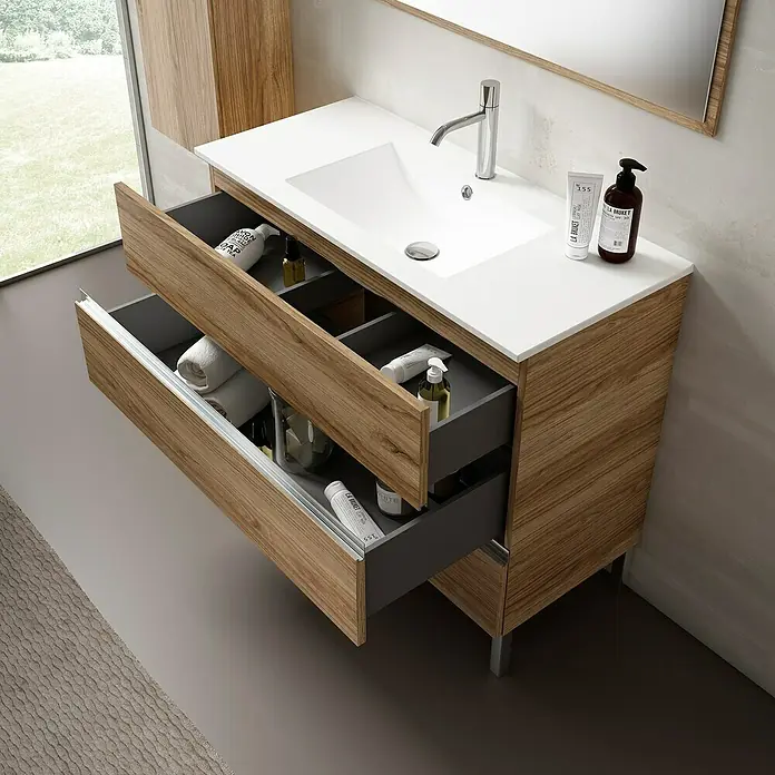 Mueble bajo de lavabo Aisling - L x An x Al: 46 x 80 x 85 cm, Teka - Moderno mueble de baño de madera con dos cajones abiertos, elegantemente amueblado con artículos de aseo y cremas.