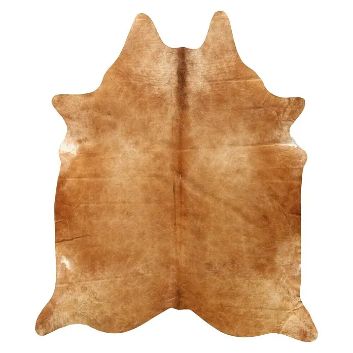 Esbeco Kuhfell - Exotisch Mittel, 100 % Echtfell - Ein beigefarbener Kuhfellteppich mit einzigartiger Textur und natürlicher Form, ideal für rustikale oder moderne Einrichtungen.