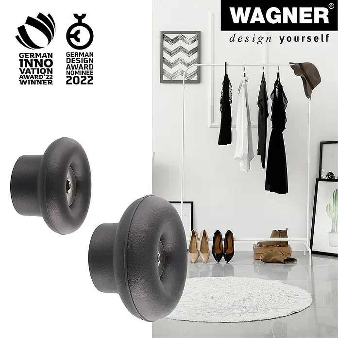 Wagner System Garderobenhaken-Set DOT - Ø x H: 50 x 30 mm, Schwarz, 4 Stk. - Nahaufnahme von zwei WAGNER Möbelknöpfen in Anthrazit, die für ihre innovative Gestaltung ausgezeichnet wurden, vor einem stilvollen Hintergrund.