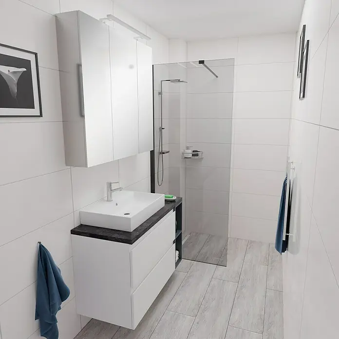 Camargue Espacio Badmöbel-Set i122 - 100 cm, Gama weiß matt - Ein modernes Badezimmer mit weißen Fliesen, einem Waschtisch mit schwarzer Arbeitsplatte und einer begehbaren Dusche.