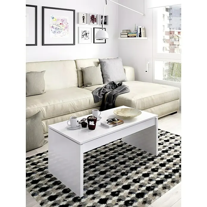 Dekit Mesa auxiliar de jardín Side - L x An x Al: 50 x 100 x 43 cm, Blanco - Una mesa de centro blanca y moderna sobre una alfombra geométrica en una sala de estar luminosa. La mesa es el punto focal.