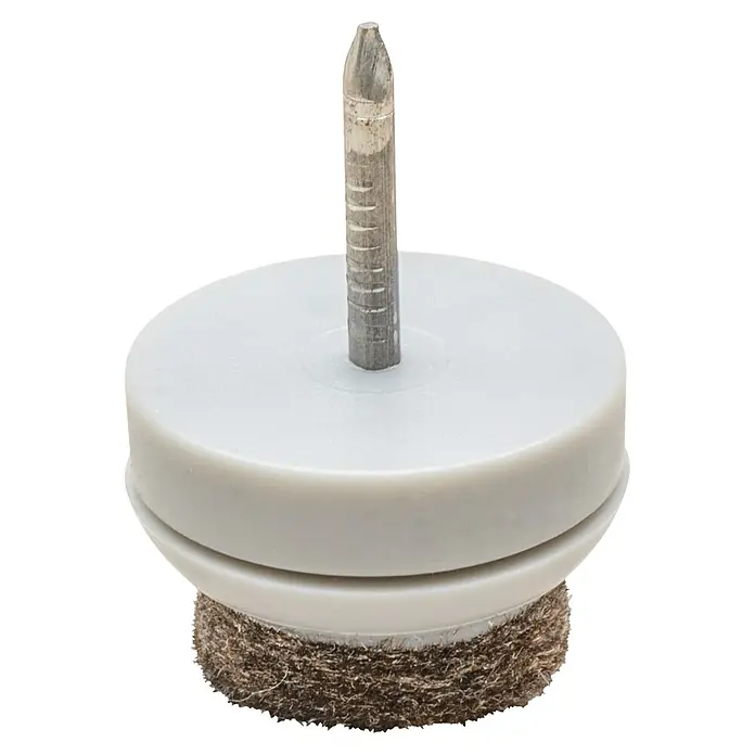 Wagner System Filzgleiter Ultrasoft - Durchmesser: 20 mm, 80 Stk., Mit Stift, Weiß - Nahaufnahme eines Möbelgleiters mit Nagel, der für den Einsatz auf Holzfußböden konzipiert ist, um Kratzer zu verhindern.