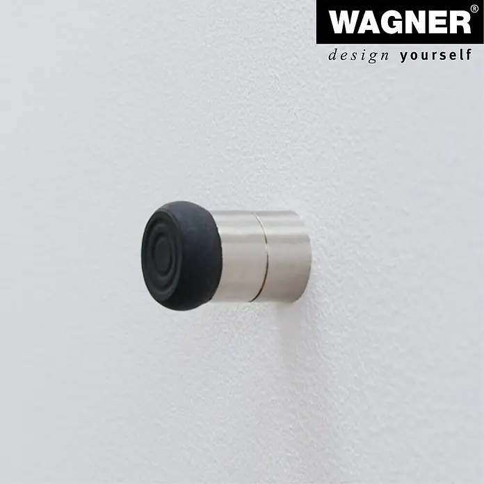 Wagner System Wandtürstopper EH5114 - 1 Stk., Edelstahl-Optik - Nahaufnahme eines Türstoppers mit einer schwarzen Gummispitze und einer silbernen Basis, der an einer weißen Wand befestigt ist.