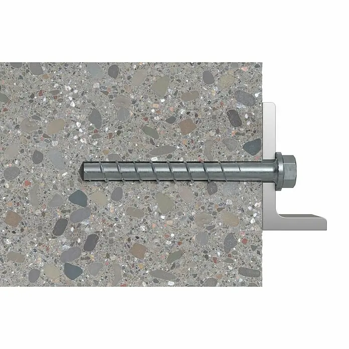 Fischer Surtido de tacos y tornillos Duoline - 91 pzs. - Primer plano de un anclaje de tornillo utilizado para fijar componentes en hormigón, mostrando claramente la estructura del tornillo.