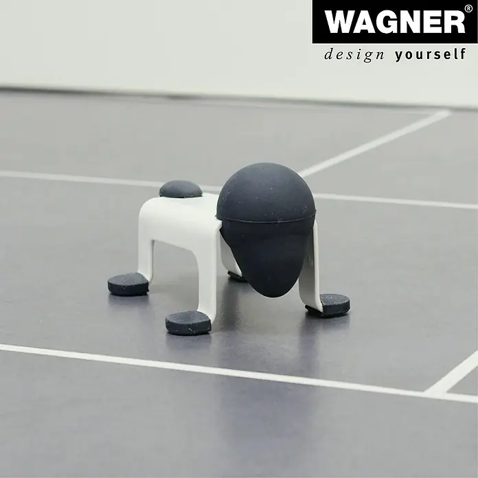 Wagner System Bodentürstopper EH5205 - L x B x H: 59 x 106 x 71 mm, Stahl, Weiß - Türstopper "Doggy" von Wagner: Eine witzige und funktionale Ergänzung für Ihr Zuhause. Der Türstopper ist weiß mit schwarzen Gummiakzenten.