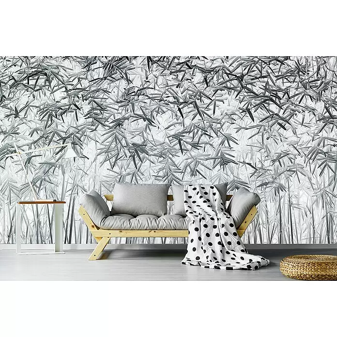 Papermoon Premium collection Fototapete Parallelität - B x H: 300 x 223 cm, Vlies - Hölzernes Futonsofa mit hellgrauen Kissen und einer weiß-schwarz gepunkteten Decke im Raum.