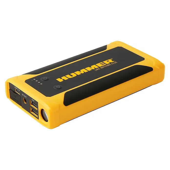 Kit de arranque HUMMHX - 12 V, 3 Ah - La imagen muestra un arrancador de batería Hummer amarillo y negro con varios puertos como USB y salida de 12V. El dispositivo también tiene una luz LED integrada.
