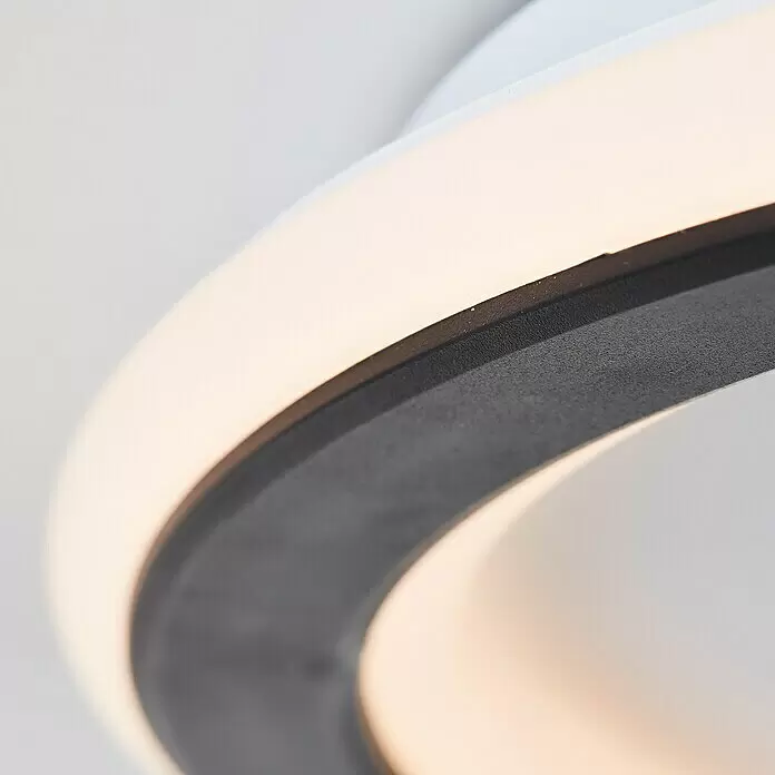 Brilliant LED-Deckenleuchte rund Vegas - 24 W, Durchmesser: 30,8 cm, Weiß, Warmweiß - Nahaufnahme einer LED-Ringlampe mit weißer Beleuchtung und dunkelgrauem Rahmen.