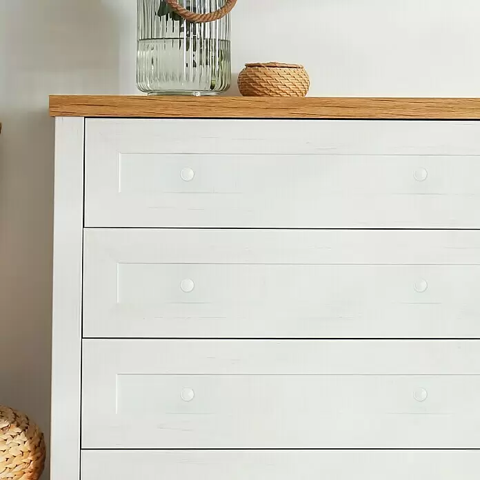 Häfele Pomo para muebles - Tipo de tirador del mueble: Botón, Ø x Al: 40 x 25 mm, Plástico, Blanco - Cómoda blanca con tapa de madera y cuatro cajones, cada uno con un pomo redondo blanco.