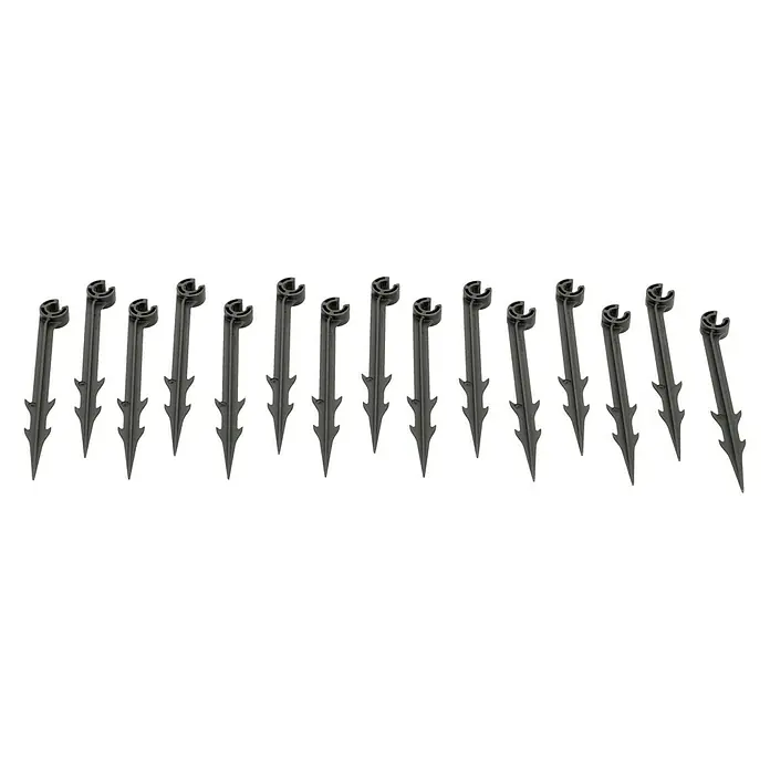 Gardena Micro-Drip Rohrhalter - 15 Stk., Größe Anschluss: ³⁄₁₆″ - Eine Reihe von Rasenbewässerungs-Befestigungsheringen, die aus grauem Kunststoff für eine sichere Installation gefertigt sind.