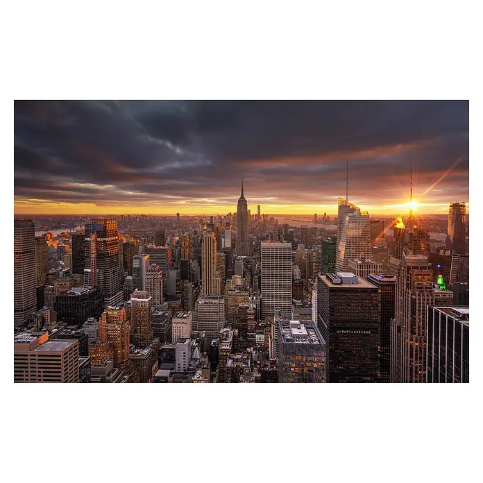 Papermoon Premium collection Fototapete Oben - B x H: 300 x 223 cm, Vlies - Beeindruckende Aufnahme der New Yorker Skyline bei Sonnenuntergang. Die ikonischen Wolkenkratzer erstrahlen in warmen Farben.