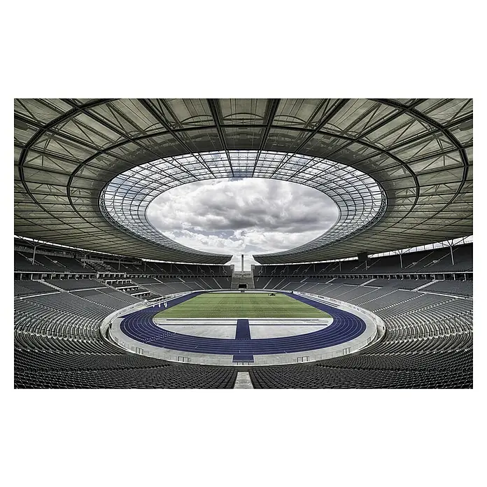 Papermoon Premium collection Fototapete Berlin - B x H: 200 x 149 cm, Vlies - Olympiastadion Berlin: Weitläufige Tribünen und die blaue Laufbahn unter dem ikonischen Dach.