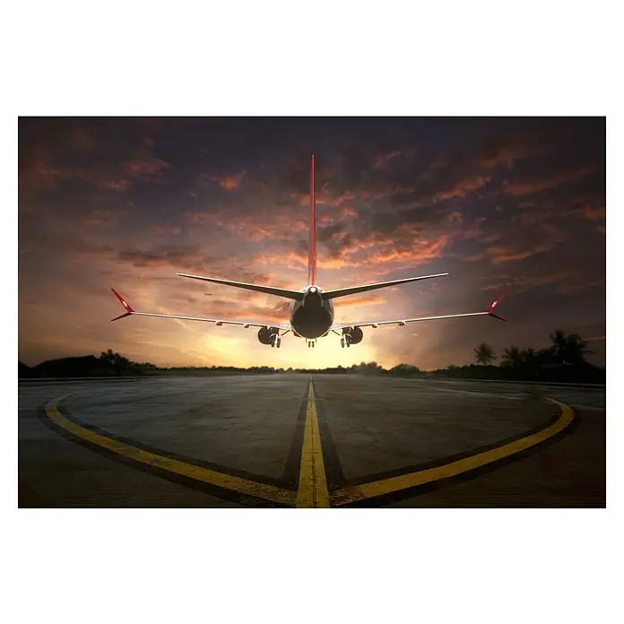 Papermoon Premium collection Fototapete Den Sunset jagen - B x H: 450 x 280 cm, Vlies - Flugzeug startet bei Sonnenuntergang. Das Bild zeigt das Heck des Flugzeugs auf der Startbahn, die sich in den orangefarbenen Himmel erstreckt.
