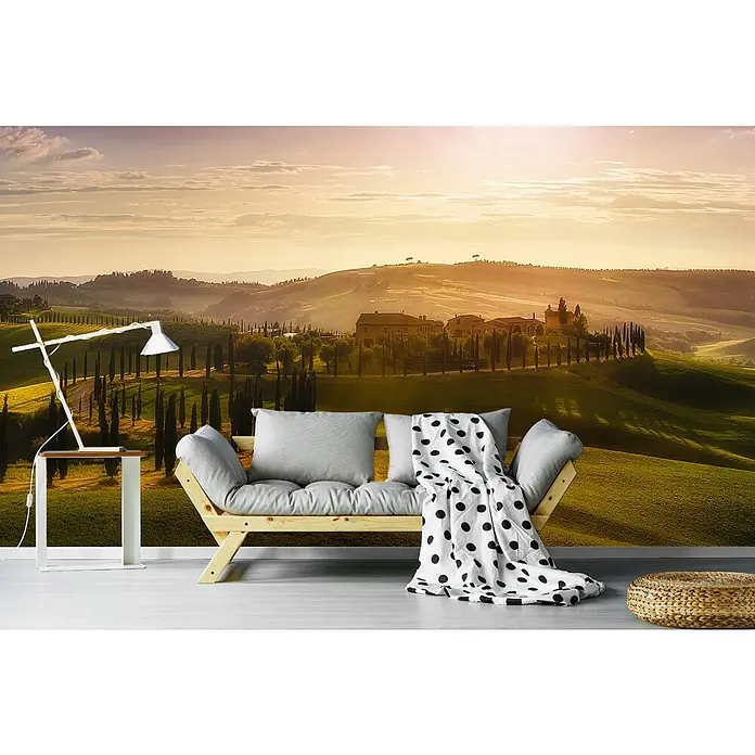 Papermoon Premium collection Fototapete Wellen des Lichts - B x H: 250 x 186 cm, Vlies - Fototapete mit einer toskanischen Landschaft im Hintergrund, ergänzt durch eine stilvolle Couch, Tischlampe und einen Hocker für ein komplettes Raumambiente.
